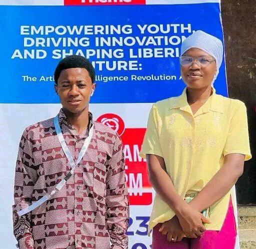 Youth collaborating with laptops